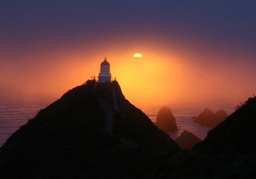 sunrise at nugget point lighthouse